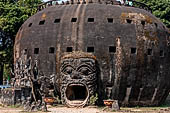 Vientiane , Laos. The Buddha Park (Xiang Khouan), giant pumpkin with a large open mouth serving as the entrance 